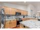 Modern kitchen featuring light wood cabinets, granite countertops, stainless steel appliances, and tile backsplash at 4043 S Shady Ct, Gilbert, AZ 85297