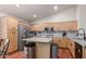 Modern kitchen featuring light wood cabinets, granite countertops, stainless steel appliances, and tile backsplash at 4043 S Shady Ct, Gilbert, AZ 85297