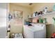 Laundry room featuring washer, dryer, shelving, window and natural light at 4043 S Shady Ct, Gilbert, AZ 85297
