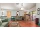 Bright living room with hardwood floors, neutral walls, and sliding glass doors leading to the backyard at 4043 S Shady Ct, Gilbert, AZ 85297