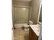 Functional bathroom featuring a tub/shower combo, toilet, and vanity with sink, ready for upgrades at 4119 N 105Th Ln, Phoenix, AZ 85037