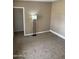 Cozy bedroom with neutral carpeting and paint, providing a blank canvas for your design ideas at 4119 N 105Th Ln, Phoenix, AZ 85037
