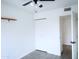 Bright bedroom features new floors, fan, closet and open closet space at 4124 N 81St St, Scottsdale, AZ 85251
