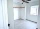 Bright bedroom with ceiling fan, ample natural light, and open closet space at 4124 N 81St St, Scottsdale, AZ 85251