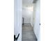 Bright hallway features grey wood floors and white textured brick wall at 4124 N 81St St, Scottsdale, AZ 85251