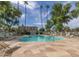 Community pool with ample seating, shaded areas, and tall palm trees creating a tranquil and inviting atmosphere at 4124 N 81St St, Scottsdale, AZ 85251