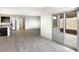 Open concept living space featuring tile flooring, and sliding glass doors to the backyard patio at 42895 W Vincent Dr, Maricopa, AZ 85138