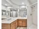 Bright bathroom with double sink vanity, large mirror, and walk-in shower at 4301 N 21St St # 3, Phoenix, AZ 85016