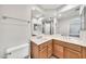 Bright bathroom with double sink vanity, large mirror, and toilet at 4301 N 21St St # 3, Phoenix, AZ 85016