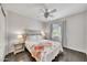 Bright bedroom with ceiling fan, floral-themed bedding, and side tables at 4301 N 21St St # 3, Phoenix, AZ 85016