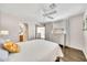 Bright bedroom with white ceiling fan, ensuite bathroom and a walk-in closet at 4301 N 21St St # 3, Phoenix, AZ 85016