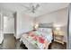 Bright bedroom with ceiling fan, a closet and floral-themed bedding at 4301 N 21St St # 3, Phoenix, AZ 85016