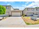 Inviting townhome with a two-car garage, landscaped front yard, and paved driveway at 4301 N 21St St # 3, Phoenix, AZ 85016