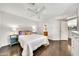 Bright main bedroom with hardwood floors, ceiling fan, and ensuite bathroom at 4301 N 21St St # 3, Phoenix, AZ 85016