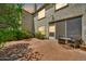 Charming backyard brick patio offers outdoor seating, lush greenery, and space for relaxing at 4301 N 21St St # 3, Phoenix, AZ 85016