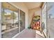 Enclosed tiled patio with sliding glass doors and storage shelf at 4301 N 21St St # 3, Phoenix, AZ 85016