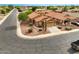 Aerial view of a corner lot home with desert landscaping and a two-car garage at 44010 W Wade Dr, Maricopa, AZ 85138