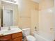 Cozy bathroom featuring a tub, shower, toilet, and vanity sink at 44010 W Wade Dr, Maricopa, AZ 85138