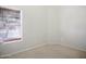 Neutral bedroom featuring a window with blinds and carpeted floors at 44010 W Wade Dr, Maricopa, AZ 85138