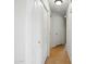 Hallway featuring white doors and neutral tile flooring at 44010 W Wade Dr, Maricopa, AZ 85138