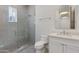 Stylish bathroom with a glass-enclosed shower and a vanity with modern fixtures and storage space at 4416 N 37Th Way, Phoenix, AZ 85018