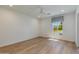 Bright bedroom with wood floors and a large window offering a view of the neighborhood at 4416 N 37Th Way, Phoenix, AZ 85018