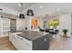 Modern kitchen features white cabinets, stainless steel appliances, and a large island with a stone countertop at 4416 N 37Th Way, Phoenix, AZ 85018
