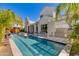Stunning pool area with outdoor kitchen, lounge seating, and lush landscaping at 4416 N 37Th Way, Phoenix, AZ 85018
