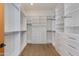 Well-organized walk-in closet with ample shelving, drawers, and hanging space for optimal storage solutions at 4416 N 37Th Way, Phoenix, AZ 85018
