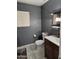 The bathroom features a toilet, a vanity with sink, and a window for natural light at 4507 E Saint Catherine Ave, Phoenix, AZ 85042