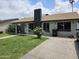 Charming single story home with a black brick chimney and well kept lawn at 4507 E Saint Catherine Ave, Phoenix, AZ 85042