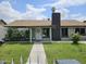 Charming single-story home featuring a well-maintained front yard with mature bushes and a welcoming entrance at 4507 E Saint Catherine Ave, Phoenix, AZ 85042