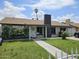 Charming single-story home featuring a well-maintained front yard with mature bushes and a welcoming entrance at 4507 E Saint Catherine Ave, Phoenix, AZ 85042