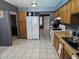 An open kitchen with spacious countertops, white appliances and dark gray walls at 4507 E Saint Catherine Ave, Phoenix, AZ 85042