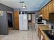 Well-equipped kitchen with wooden cabinets, white appliances, and plenty of counter space for all your cooking needs at 4507 E Saint Catherine Ave, Phoenix, AZ 85042