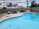 Backyard pool with a lounge area and string lights overhead at 4507 E Saint Catherine Ave, Phoenix, AZ 85042