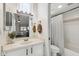 Bright bathroom features a shower-tub combo and a large mirror above the vanity at 510 N Alma School Rd # 252, Mesa, AZ 85201