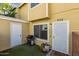Inviting front entrance with artificial turf, barbecue grill, and a charming 'Home Sweet Home' doormat at 510 N Alma School Rd # 252, Mesa, AZ 85201
