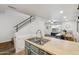 Stylish kitchen featuring a double sink, and adjacent dining area with staircase access at 510 N Alma School Rd # 252, Mesa, AZ 85201