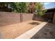 Backyard featuring small tree and a brick wall at 5217 N 18Th Dr, Phoenix, AZ 85015