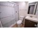 Bathroom featuring a glass shower door and floating sink at 5217 N 18Th Dr, Phoenix, AZ 85015