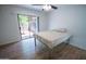 Bright bedroom featuring a sliding glass door to backyard and wood flooring at 5217 N 18Th Dr, Phoenix, AZ 85015