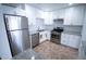 Well-equipped kitchen featuring stainless steel appliances, granite counters, white cabinets, and subway tile backsplash at 5217 N 18Th Dr, Phoenix, AZ 85015