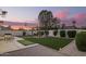Beautiful backyard with manicured lawn, putting green, cozy seating area, and stylish pergola at 5238 E Beck Ln, Scottsdale, AZ 85254