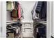 Walk in closet with organized storage and rods for hanging clothes at 5238 E Beck Ln, Scottsdale, AZ 85254