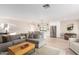 Bright, spacious living area with an open floor plan connecting the living room, kitchen, and dining areas at 5238 E Beck Ln, Scottsdale, AZ 85254