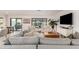Inviting living room featuring neutral tones, comfortable seating, and seamless indoor-outdoor flow at 5238 E Beck Ln, Scottsdale, AZ 85254