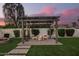 A modern pergola with chairs and firepit on the patio enhances outdoor living space at 5238 E Beck Ln, Scottsdale, AZ 85254