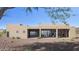 This modern home boasts expansive sliding glass doors that seamlessly connect indoor and outdoor living spaces at 532 E Paint Your Wagon Trl, Phoenix, AZ 85085