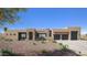 Contemporary home featuring a stone accent entry, desert landscaping, and a spacious driveway leading to a two-car garage at 532 E Paint Your Wagon Trl, Phoenix, AZ 85085